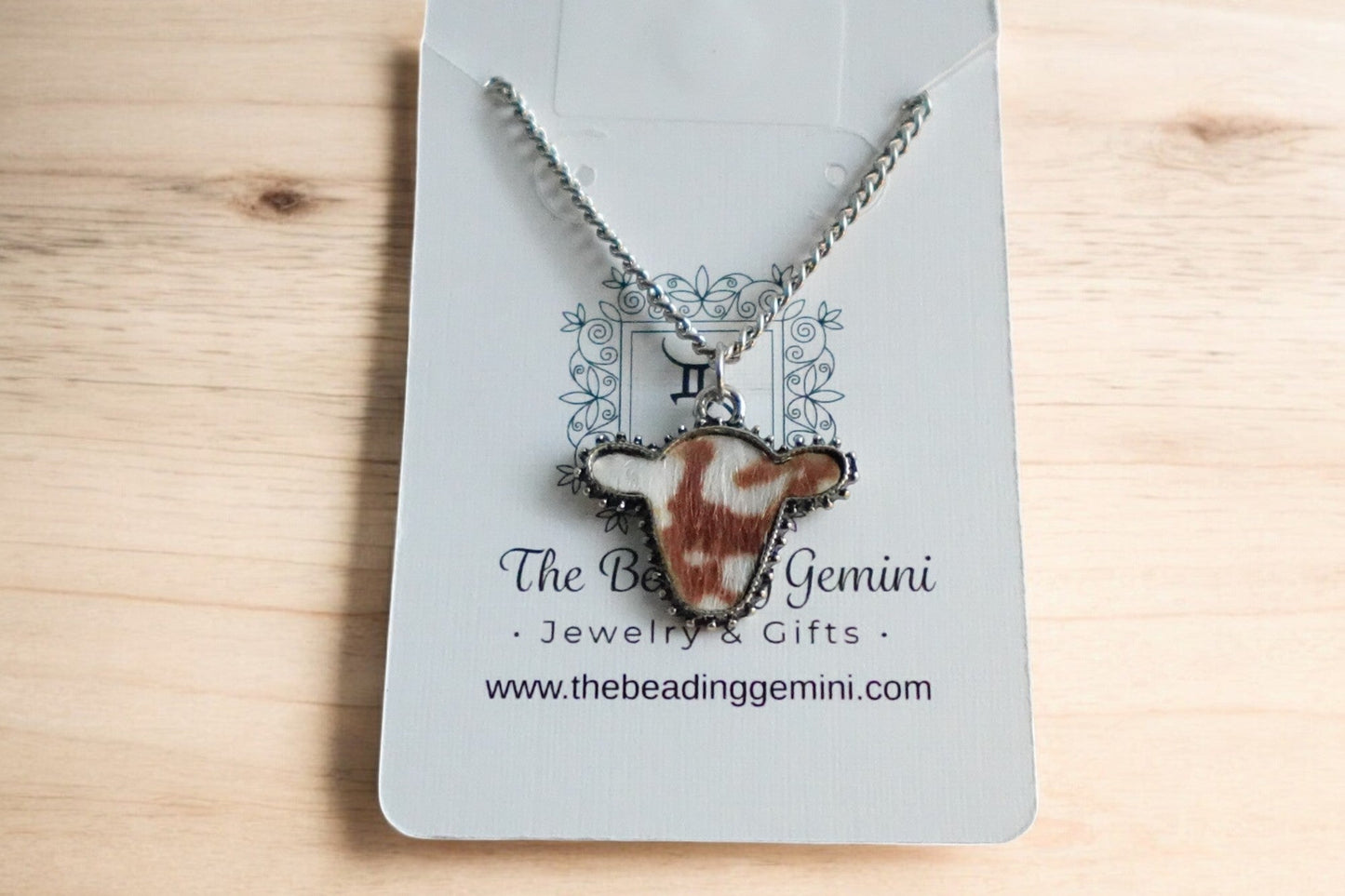 Small Brown and White Cow Charm