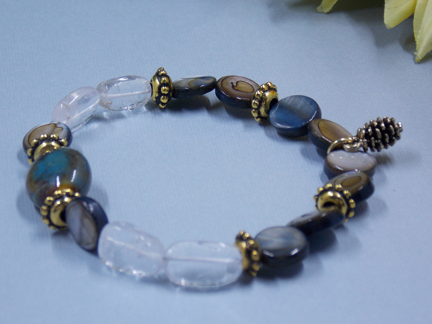Blue Gray and Clear Stones with Pinecone Charm
